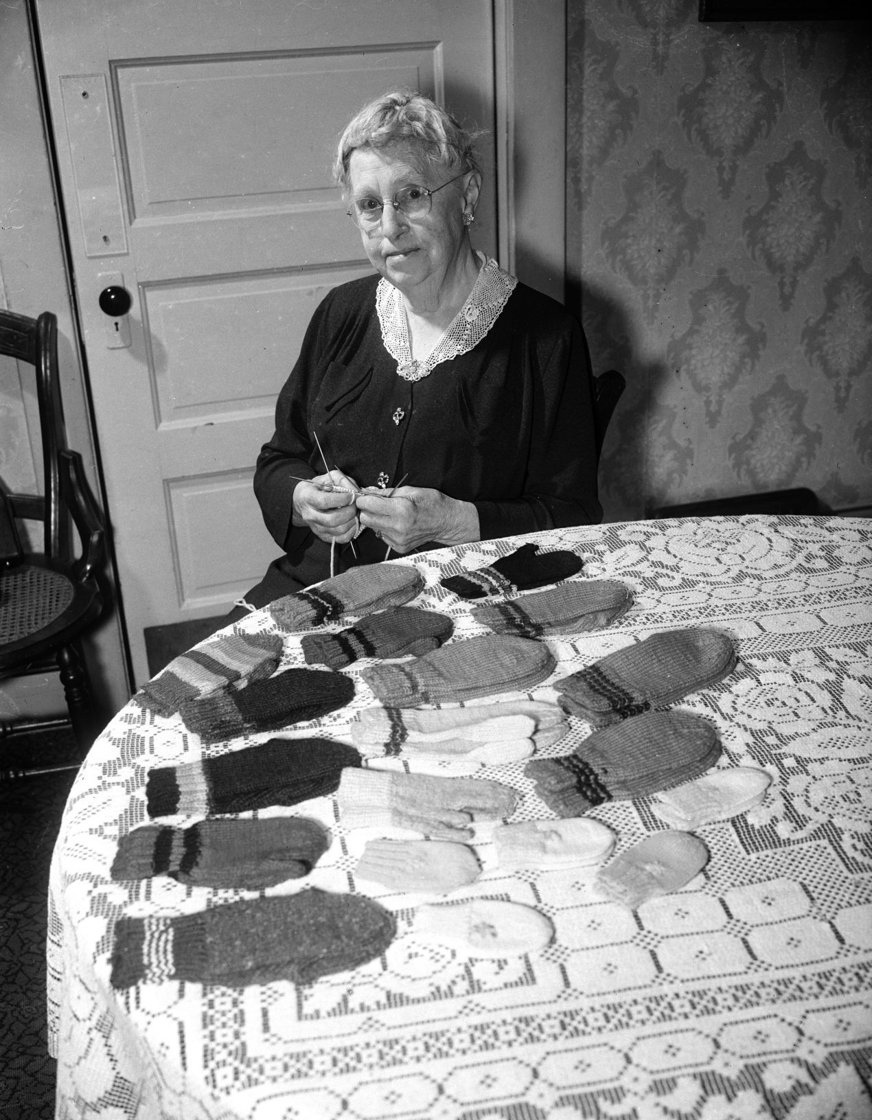 Knitting mitten for Empty Stocking Club, 1957